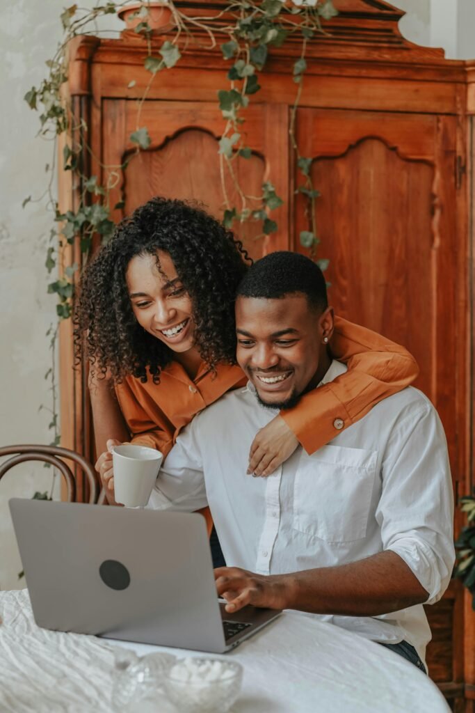 A honeymoon couple looking at resort reviews